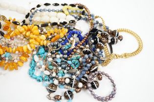 A collection of mixed beaded necklaces including agate, amber, lapis etc.