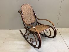 An early 20th century caned Thonet bentwood rocking chair, width 49cm, depth 90cm, height 87cm