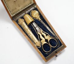A French four piece yellow metal (18ct poincon mark) necessaire, comprising a thimble, pair of