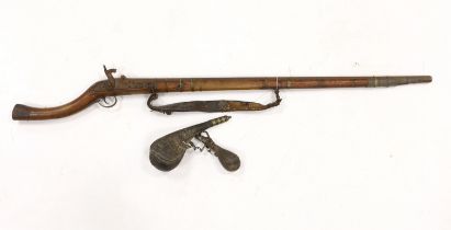 An Afghan percussion rifle with octagonal barrel and brass mounts, barrel 105.5cm, together with two