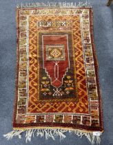 A Turkish prayer rug, 154 x 96cm