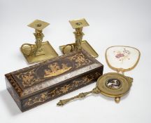 An inlaid Sorrento style box, a gilt hand mirror with enamel cartouche, a pair of brass candle