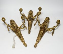 A set of three Louis XVI style two branch ormolu wall lights, 38cm high