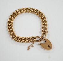 An Edwardian 15ct curb link bracelet, with heart shaped padlock clasp, 18cm, 21.9 grams.