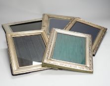Four assorted modern silver mounted photograph frames, largest 25.9cm and one silver plated