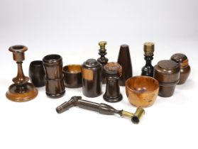 A collection of 19th/20th century lignum vitae vessels and desk items, to include a pepper pot, salt