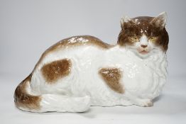 A large Meissen style figure of a seated cat, pseudo crossed swords mark to the base, 37cm wide