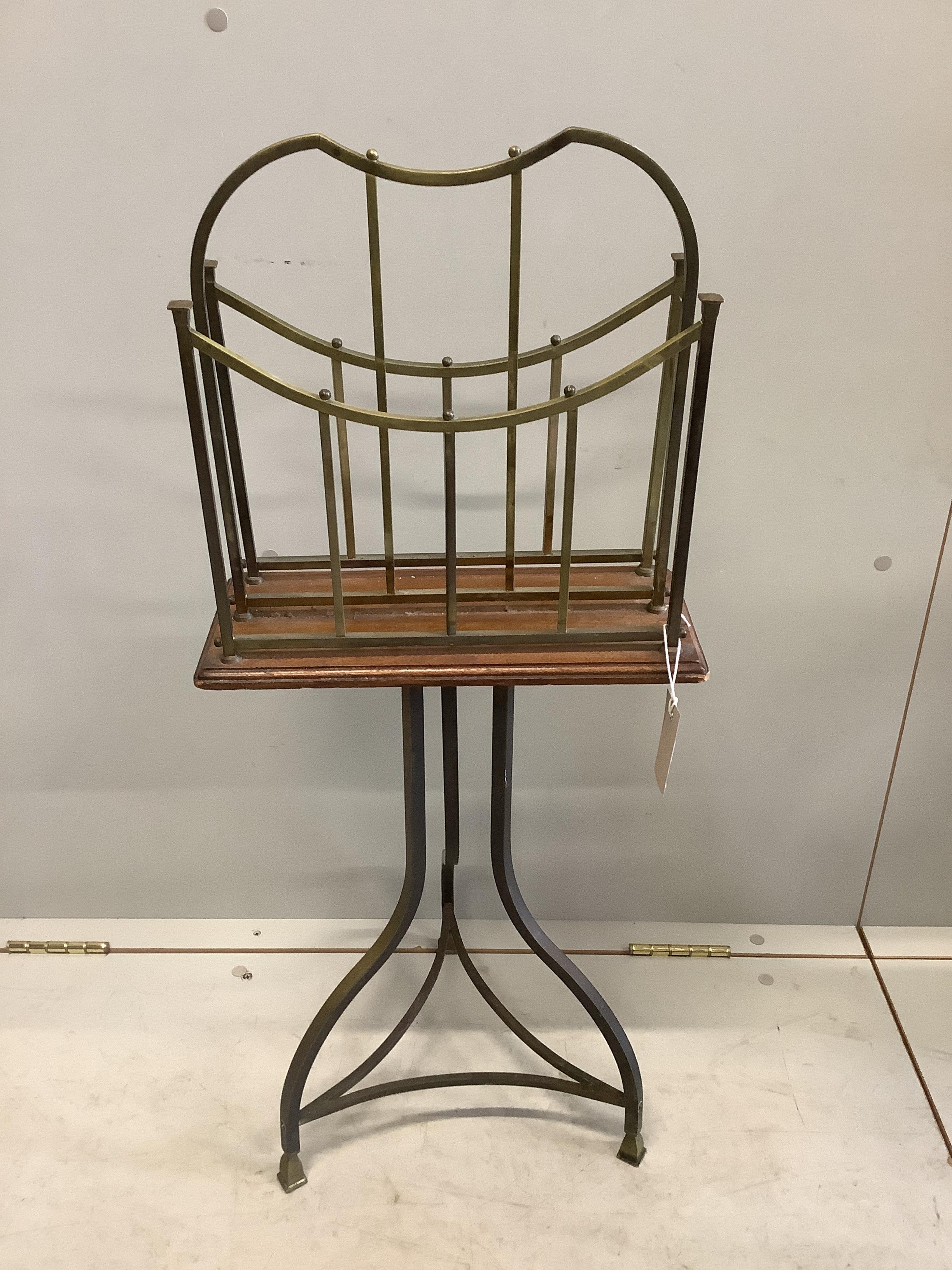 An early 20th century oak and brass two division revolving newspaper stand, width 36cm, depth