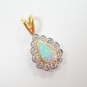 A modern 18ct gold, white opal and diamond set pear shaped cluster pendant, overall 23mm, gross
