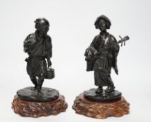 Two Japanese Meiji period bronzes, a water carrier and a woman playing a Shamisen, both signed, each
