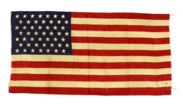A 1959 USA flag, ‘Stars and Stripes’ printed on light open woven material, forty-nine stars, seven