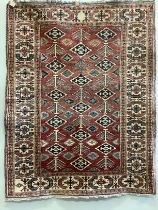 A Caucasian style red ground rug, 170 x 143cm