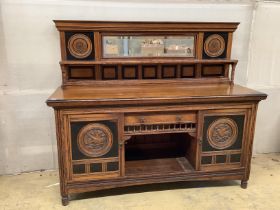 A late Victorian Aesthetic movement oak and parcel ebonised mirror back sideboard, width 183cm,