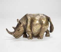 An Elizabeth II silver miniature model of a rhinoceros, by Stuart Devlin, London, 1985, length
