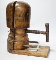 A vintage miliner's hat mould, 35cm high