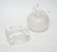 A Lalique apple shaped perfume bottle and leaf stopper together with a square ashtray, both with