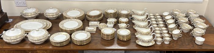 An extensive Wedgwood Gold Florentine dinner service, consisting:- 26 dinner plates, 50 side plates,