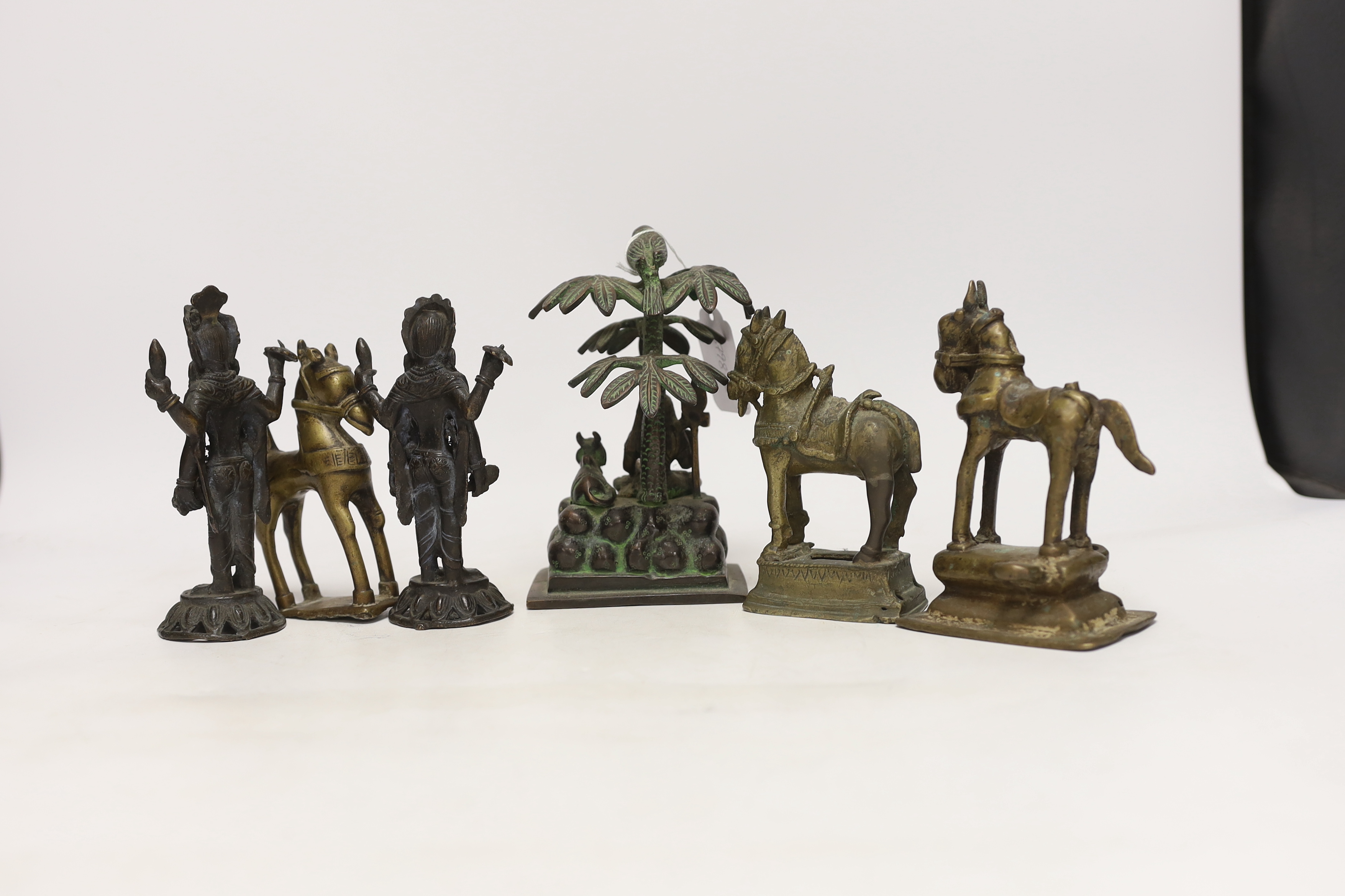 Six Indian bronze/brass ornaments; Shiva sitting under a bael tree with a bird, 17cm, two figures of - Image 5 of 5