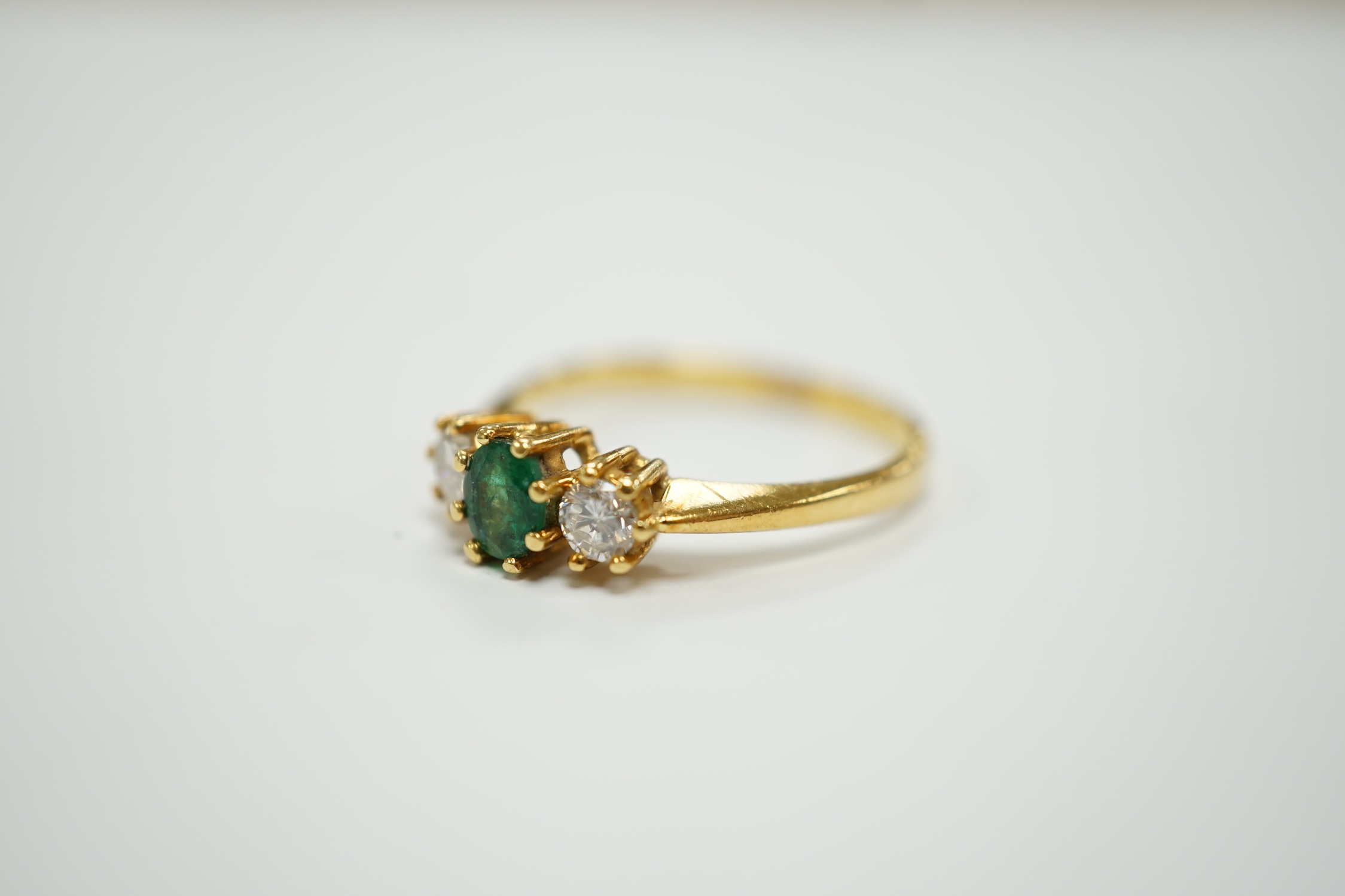 A modern 18ct gold, emerald and diamond set three stone ring, size P, gross weight 3.2 grams. - Image 2 of 5