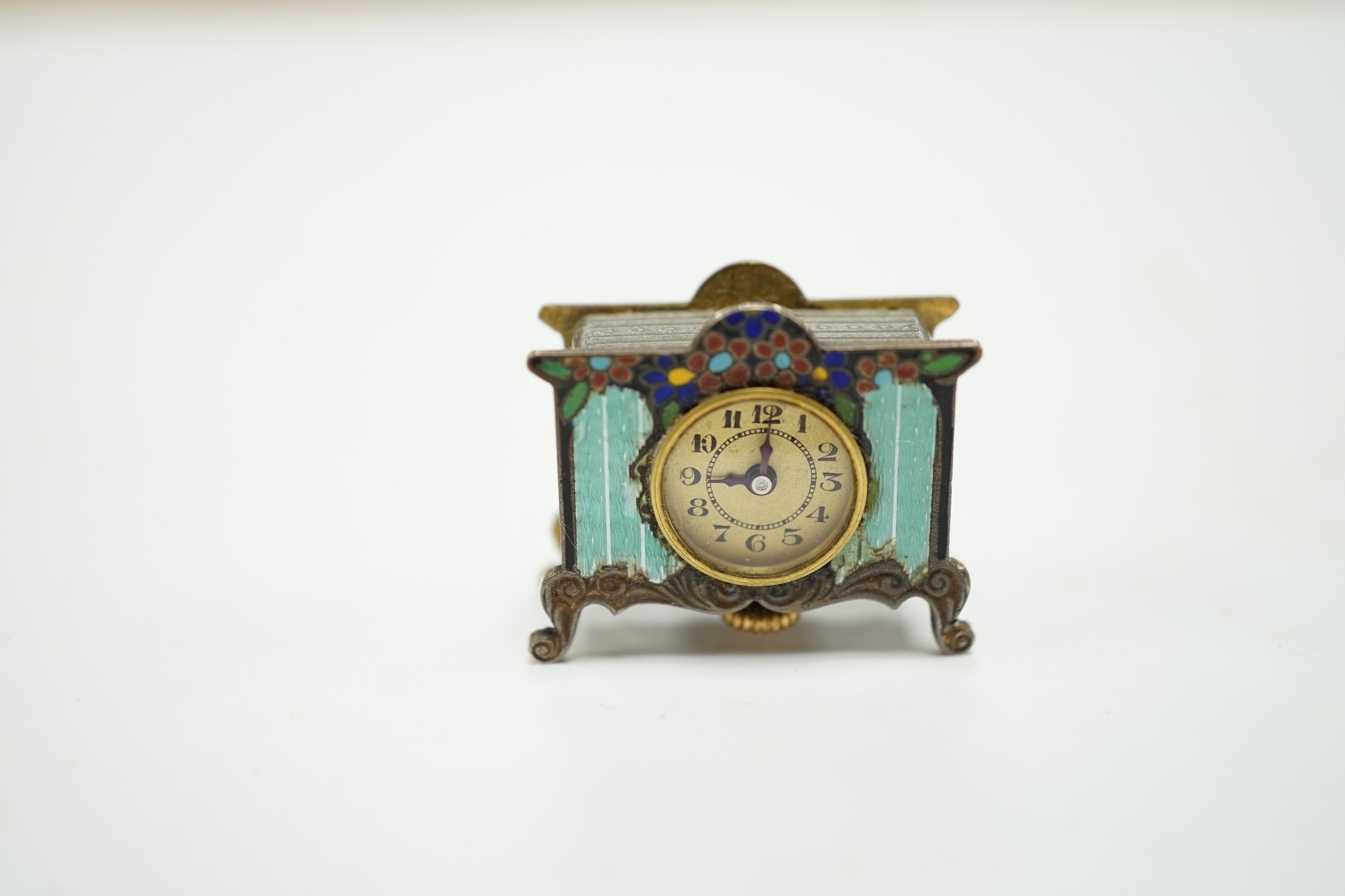 A miniature enamel timepiece modelled as a mantle clock, with watch movement, 2cm high, in fitted - Image 2 of 5