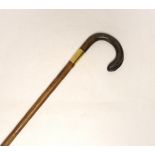 A gold banded walking stick with horn handle, 92cm