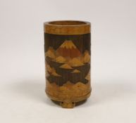 A Japanese bamboo brushpot carved with mountains and pagodas, 13cm high