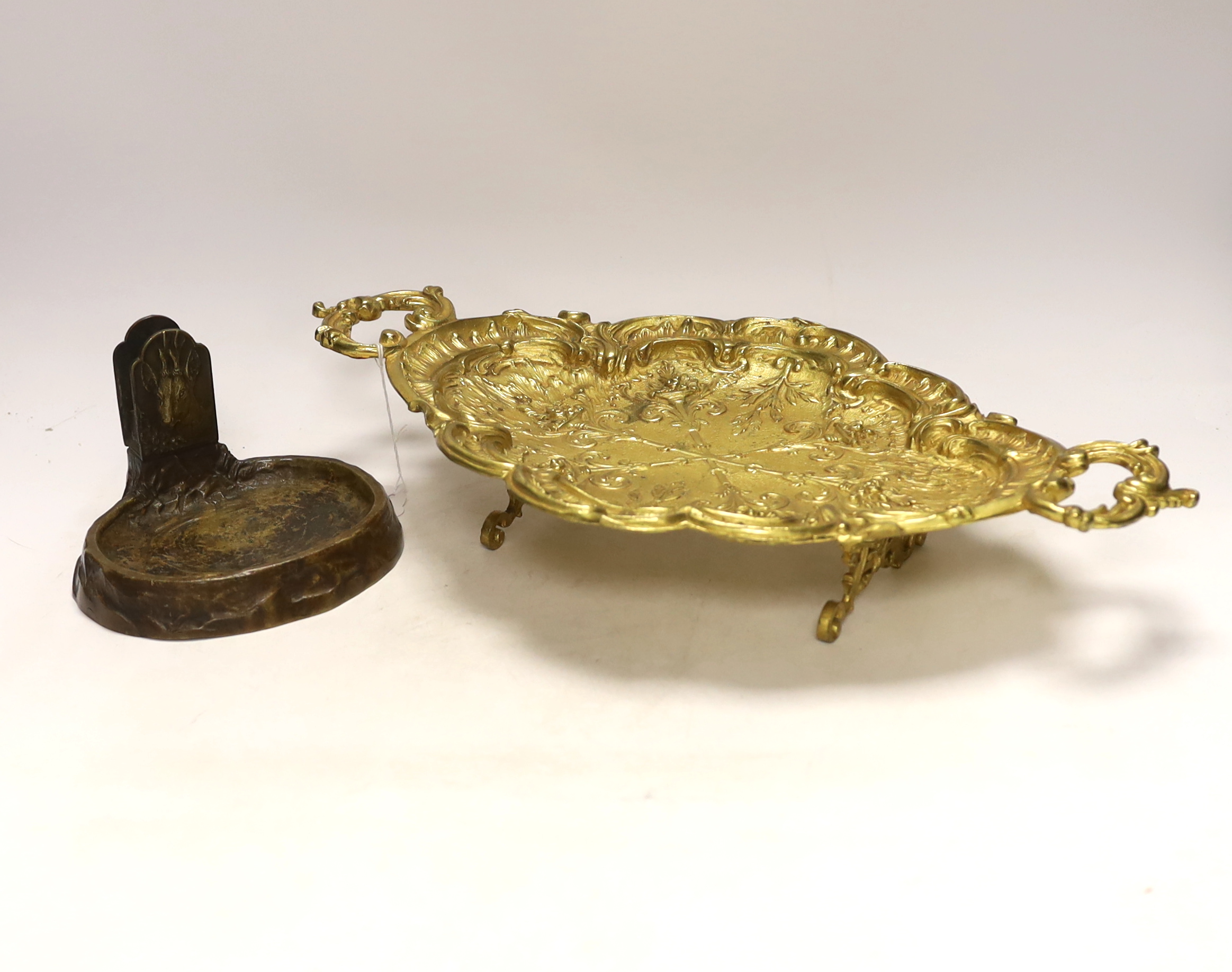 A gilt metal oval dish with twin handles and match tray, 43cm wide