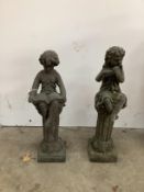 Two cast metal figural garden ornaments, larger height 40cm