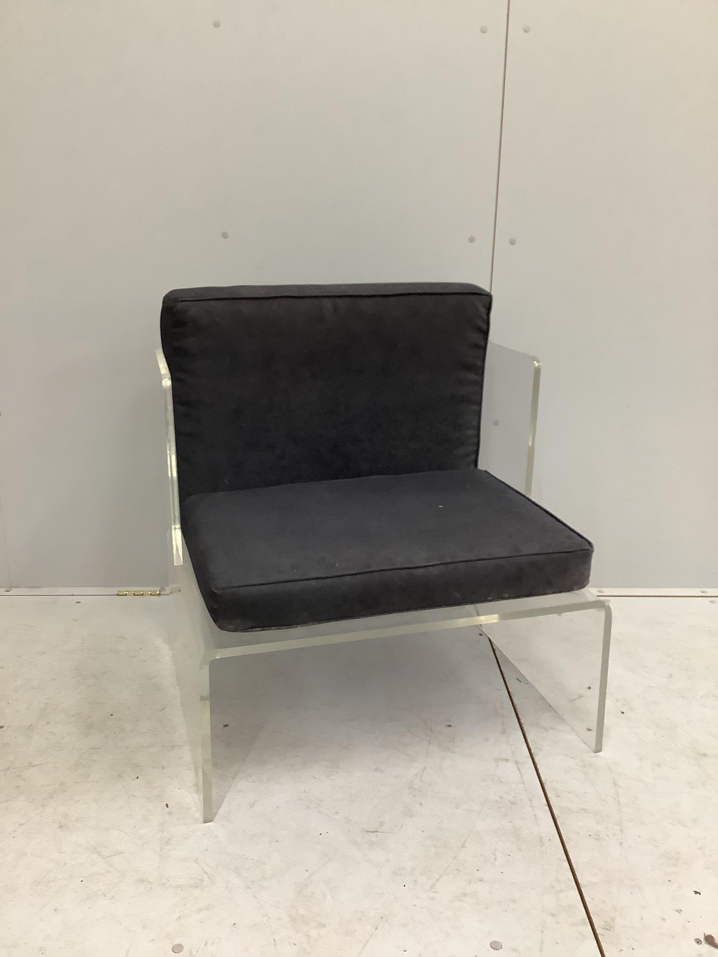 A contemporary mid century Lucite acrylic chair, width 73cm, depth 60cm, height 80cm