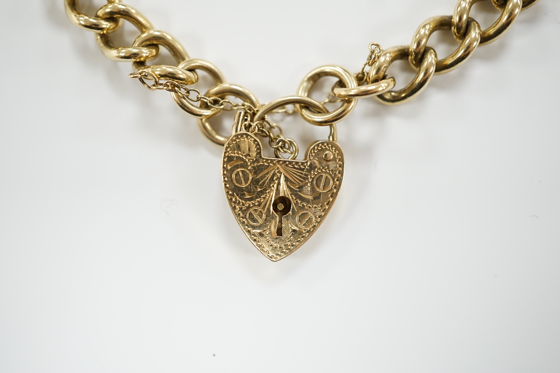 A 9ct gold curb link bracelet with 9ct padlock, 18cm, 22.5g. - Image 2 of 4