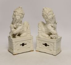 A pair of Chinese blanc de chine lion dogs, 21cm high