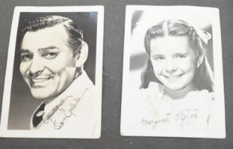A vintage black and white photograph album with some autographs including Lucille Ball and