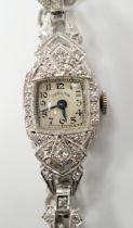 A lady's white metal (stamped irid and platinum) and diamond cluster set manual wind Hamilton