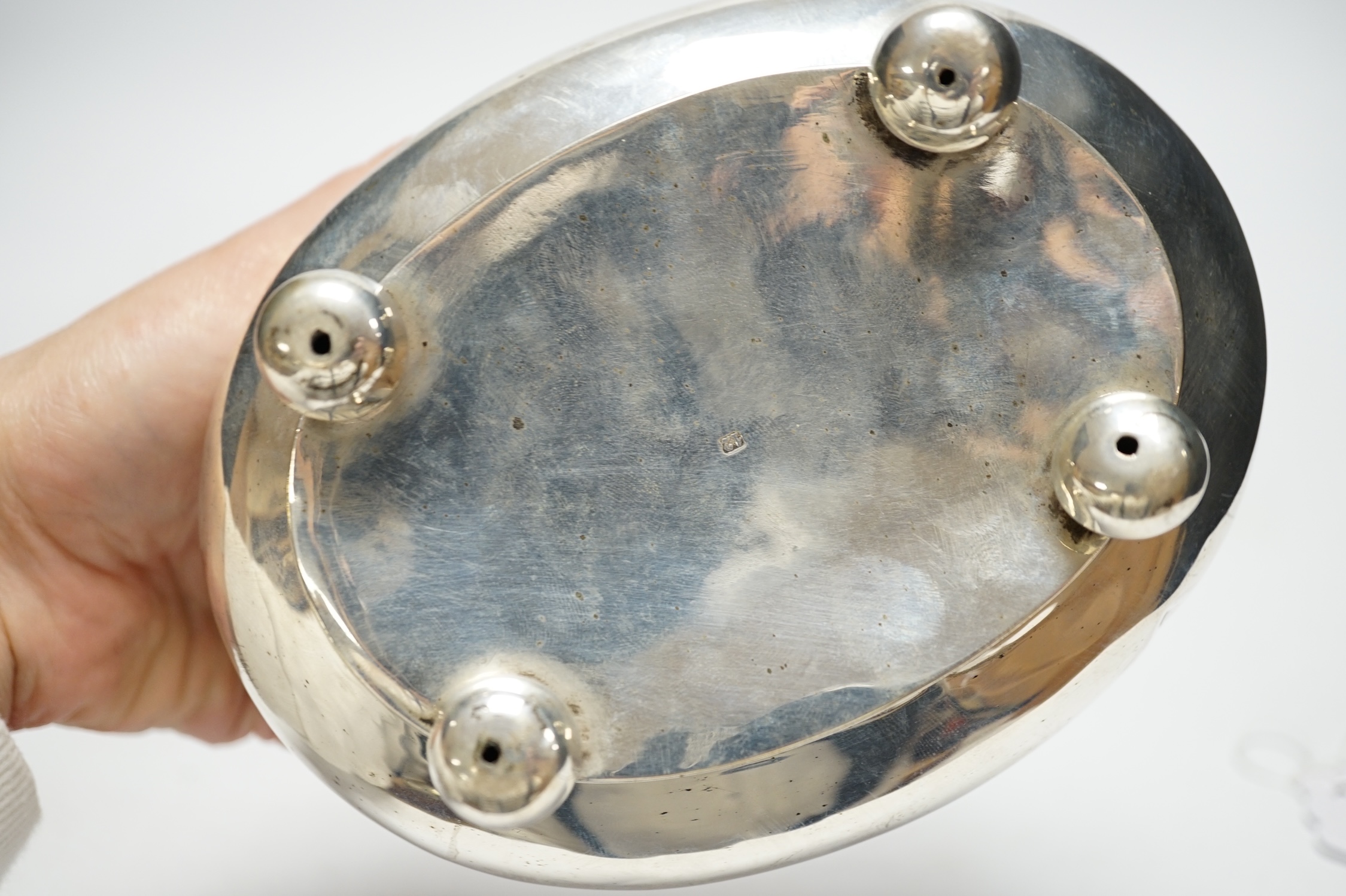 A 19th century German? white metal oval tea caddy, on bun feet, lacking key, width 16cm, 8.8oz. - Image 3 of 3