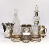 Two decanters; one with silver mount and one with etched body, together four wine coasters, a bucket