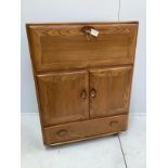 An Ercol elm bureau / cabinet, width 82cm, depth 44cm, height 109cm