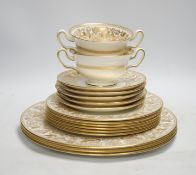 A Wedgwood bone china gold Florentine part dinner service, including an oval dish, twin handled cups
