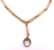 An early 20th century 9ct gold albert, hung with a damaged yellow metal spinning fob, gross weight