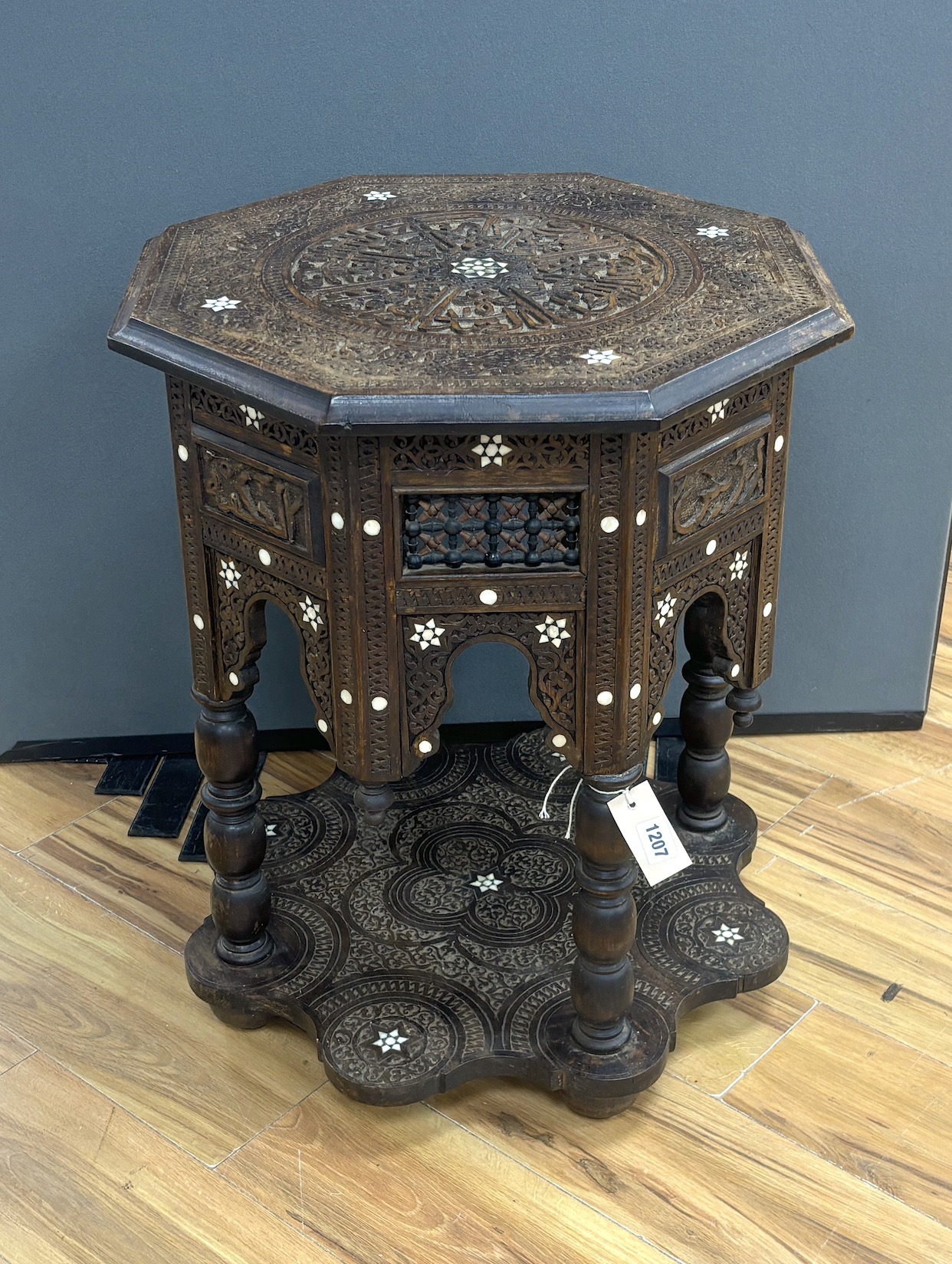 A Moroccan octagonal bone inlaid hardwood table, width 52cm, height 64cm