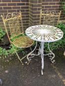 A circular metal garden table, diameter 58cm, height 76cm and two folding chairs