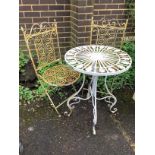 A circular metal garden table, diameter 58cm, height 76cm and two folding chairs