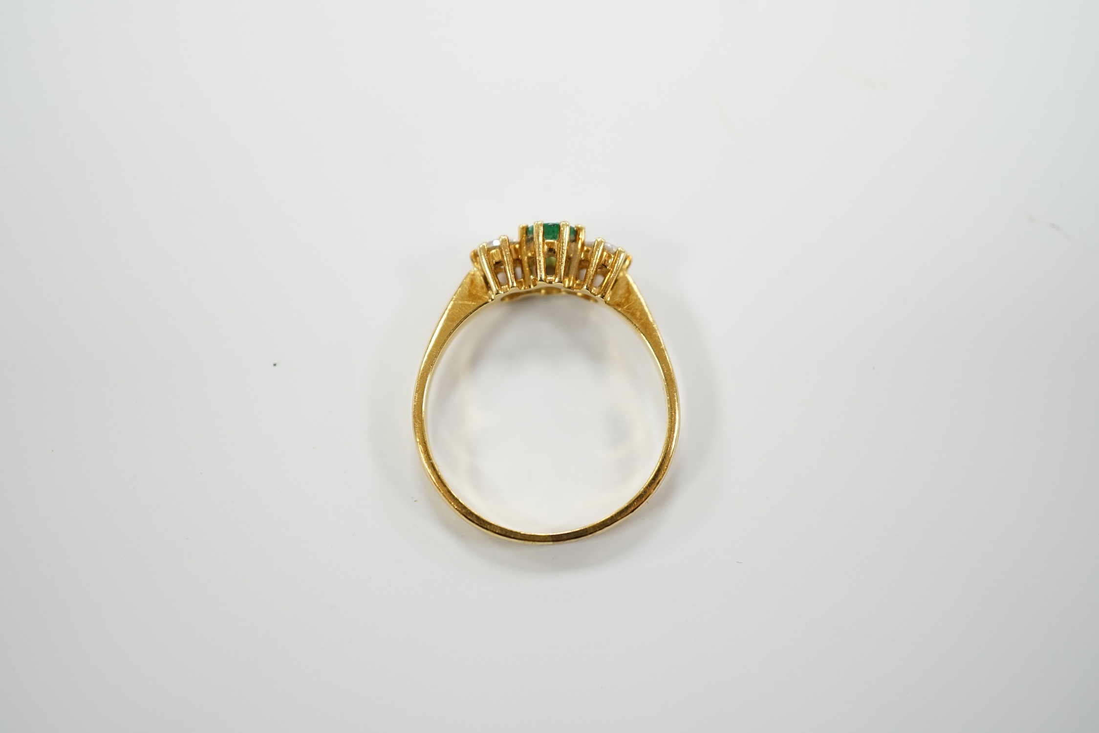 A modern 18ct gold, emerald and diamond set three stone ring, size P, gross weight 3.2 grams. - Image 5 of 5