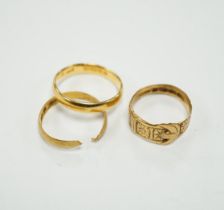 Two 22ct gold wedding bands (one cut), 5.8 grams and an 18ct gold buckle ring, 2.9 grams.