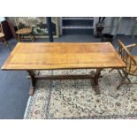 An Arts & Crafts style rectangular oak refectory dining table, width 175cm, depth 73cm, height 73cm