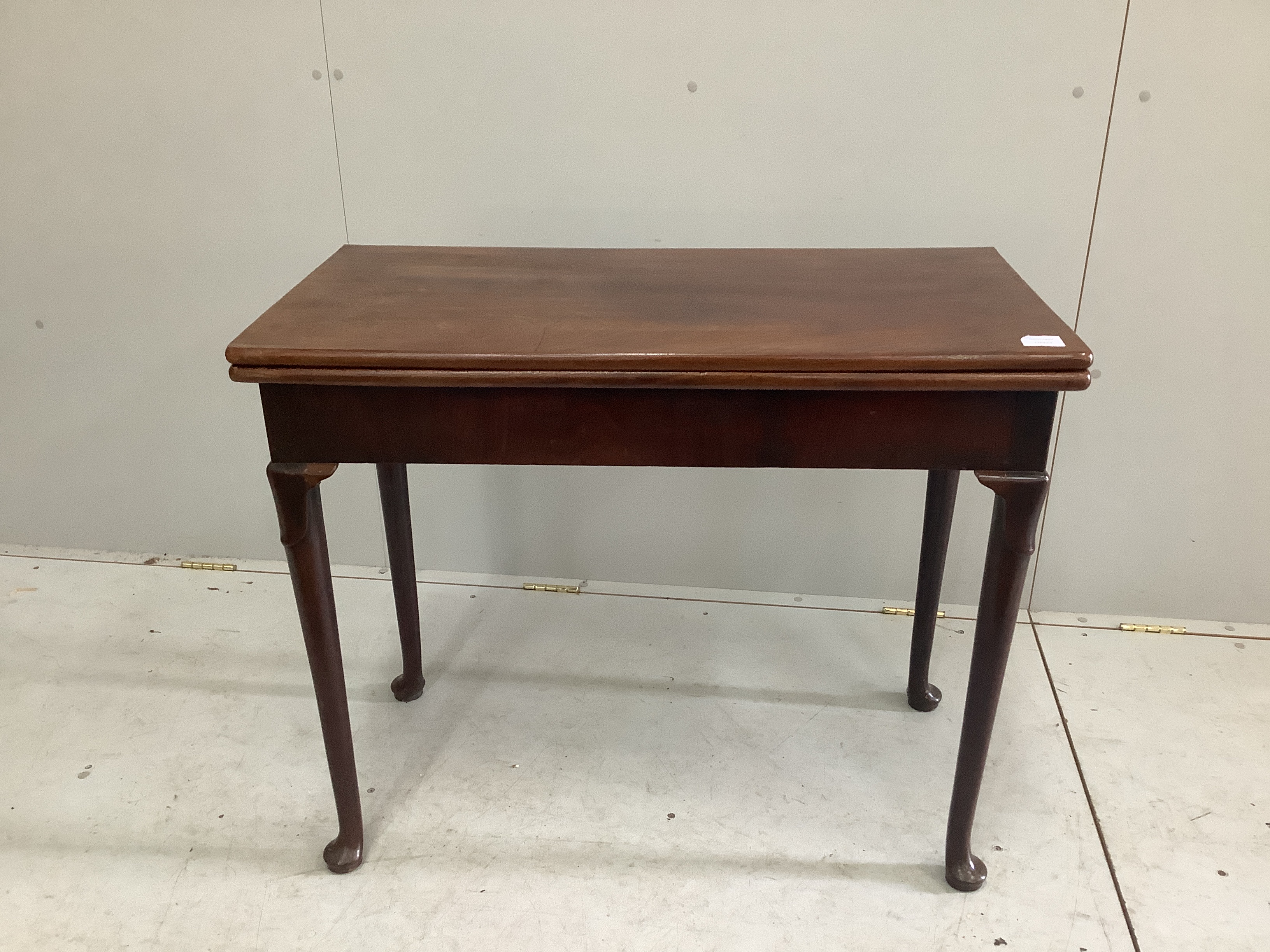 A George III rectangular mahogany folding card table, width 88cm, depth 44cm, height 73cm