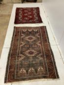 A Caucasian blue ground rug, worn together with an Afghan style rug, larger 140 x 85cm