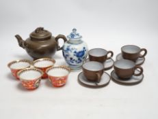 A Chinese blue and white tea caddy, four tea bowls, four cups and saucers and a teapot, largest 17cm
