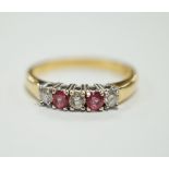 An 18ct gold, two stone pink sapphire? and three stone diamond set half hoop ring, size O, gross