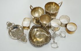 Assorted small silverwares including napkin rings, mugs, tea strainer and pair of Georgian sugar