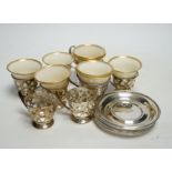 A set of six Limoges Lenox coffee cups with sterling holders and saucers and a pair of larger